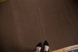 Textured chocolate brown Moroccan Kilim with natural wool variations.