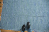 Vintage Turkish throw cloth with thin woven texture and abrashed blue denim tones.