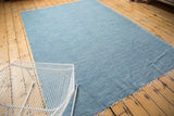 Abrashed denim blue and powder blue texture of a vintage Turkish throw cloth with fringe.
