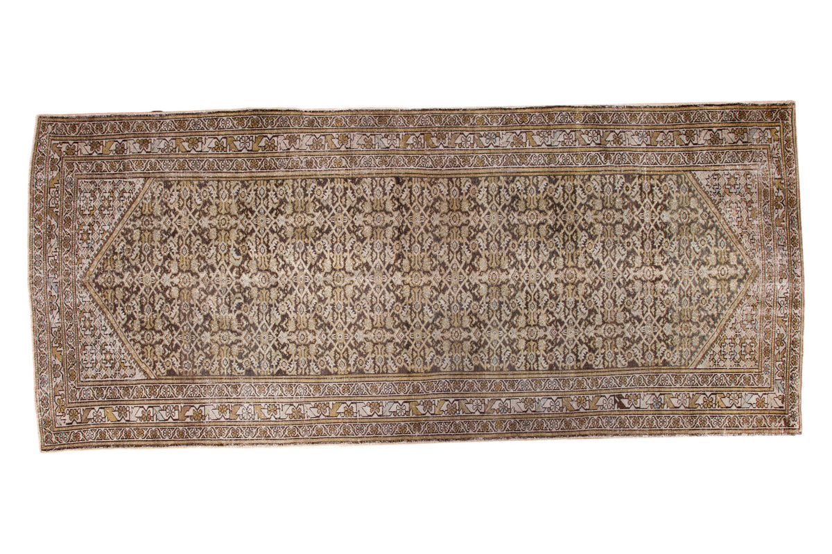 Distressed vintage Hamadan runner, faded Herati pattern, time-softened silver charcoal and ivory.