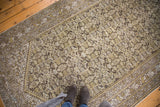 Distressed Herati pattern and intricate border of vintage Hamadan runner, in ivory, gold, charcoal.