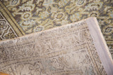 Close-up of the vintage distressed Hamadan rug's even wear, secured side, and visible foundation.