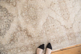 Vintage Turkish Sparta rug runner showing distressed ivory and beige medallion motifs.