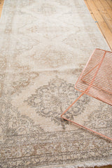 Distressed Sparta runner medallion and lattice in soft ivory, beige, and pewter tones.
