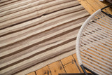 Natural beige and brown striated flat weave on a vintage Moroccan Kilim rug.