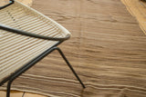 Vintage Moroccan Kilim rug showcasing striated natural brown and beige tones.