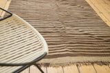 Vintage Moroccan Kilim rug displaying natural striated brown and beige tones and visible fringe.
