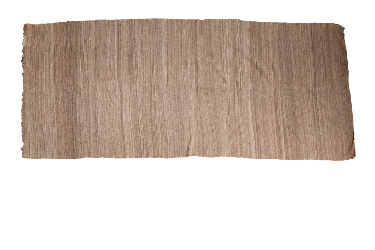 Vintage Moroccan Kilim runner, hand woven, circa 1980s, with striated natural brown and beige tones.