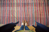 Colorful vintage Moroccan Kilim rug with randomly alternating stripes and oblique weaving.