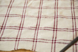 Vintage Moroccan hand woven textile with wine red and ivory plaid pattern.