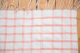 Vintage Moroccan hand woven plaid textile throw with peach orange and ivory stripes.