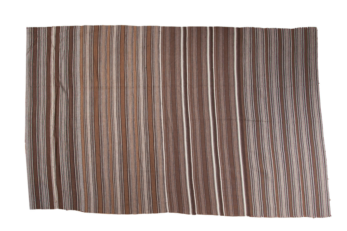 Vintage Moroccan Kilim rug, hand woven flat weave, with natural brown and beige stripes.