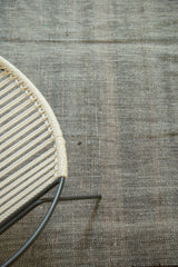 Thick, blanket-like texture with mini herringbone aesthetic on vintage wool rug.