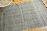 Vintage Moroccan flatwoven rug with silver and charcoal thick herringbone texture.