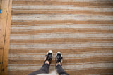 Horizontal ivory and caramel stripes with natural black wool flecks on vintage flatweave.
