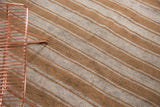 Hand woven Moroccan flatweave rug, banded ivory and caramel stripes with subtle flecks.