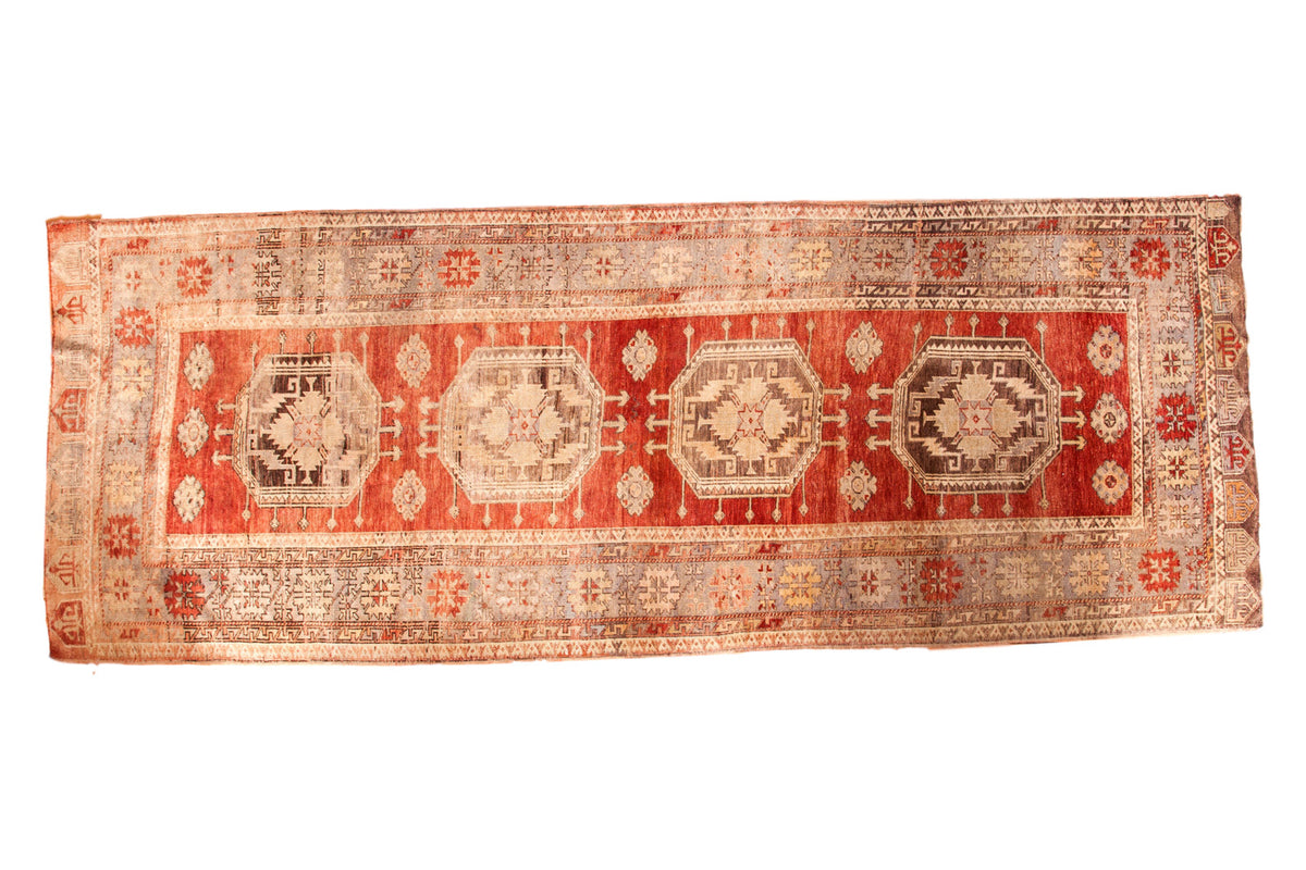 Vintage Oushak rug runner featuring quadruple octagonal medallions on a cherry red field, 5' x 13'4".