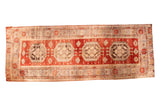 Vintage Oushak rug runner featuring quadruple octagonal medallions on a cherry red field, 5' x 13'4