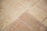 Vintage Oushak runner's ivory pile and woven peach foundation, showing varied texture.