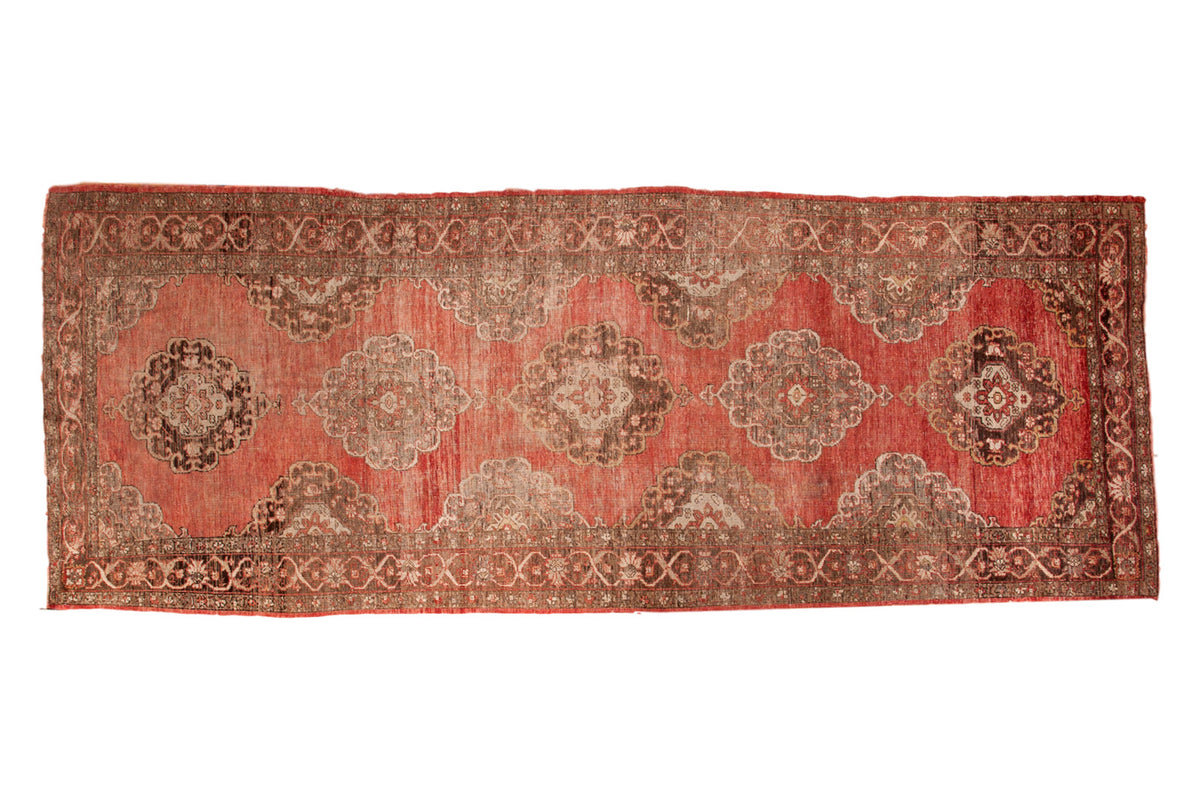 Vintage Oushak runner features scalloped medallions on an abrash-rich coral red field, 5x13.