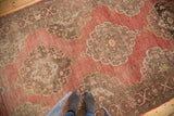 Vintage Oushak rug's blush to cherry red abrash field and Rococo scalloped medallions.