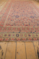Distressed vintage Malayer runner with natural fringe and saffron floral border.