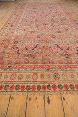 Distressed Malayer runner with textured low pile, secured fringe, and colorful saffron floral border.