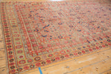 Distressed Malayer runner, partial tatter to side and faded gold floral border.