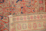 Detail of distressed Herati motif pile with knot heads recessed, revealing the hand-knotted rug back.