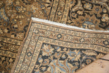 Meshed carpet corner detail: bronze, charcoal, sky blue herati motifs and secured fringe.