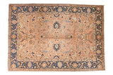 Vintage Tabriz carpet: peach apricot field with ornate floral design, navy blue border. 8'11