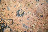 Vintage Persian carpet, peach apricot field with splayed floral palmettes and navy border.