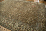 Distressed Romanian carpet's antique ivory border with faded palmettes and floral vinery.