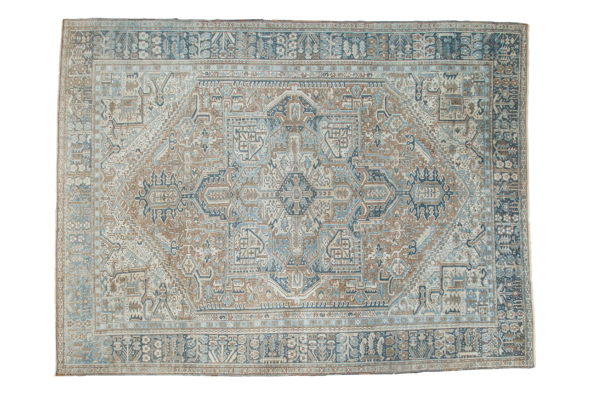 Distressed vintage Persian Karaja carpet with large medallion in blanched blue, sand, and ivory. 10x13'3".