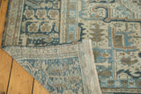 Distressed vintage Karaja carpet corner, revealing hand-knotted back and secured edge.