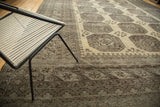 Distressed vintage Afghan carpet detail showcasing platinum gul motifs, rectilinear borders, and abrashes.