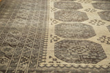 Distressed Afghan carpet: intricate rectilinear border, gul patterns, and fantastic abrashes.