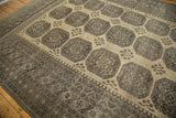 Distressed Afghan carpet with antique ivory, platinum, charcoal gul designs and visible abrashes.