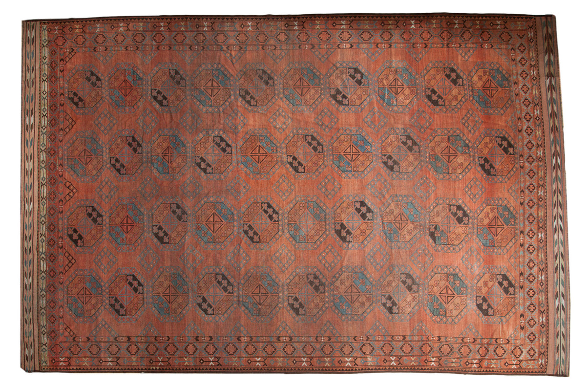 Vintage Afghani Ersari rug: madder red and sapphire blue pomegranate guls, 10'6" x 15'8".