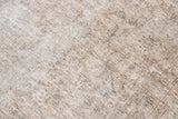 Mixed flat woven and short pile texture on a distressed vintage Sivas carpet.