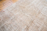 Distressed Sivas carpet's mixed flat woven and short pile texture in beige and ivory.