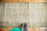 Distressed antique Malayer runner with faded ivory, charcoal, sage gold boteh field and mir serbed border.