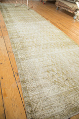 Distressed Persian Malayer rug field showing subtle ivory, pale sage gold patterns and abrashes.