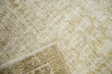 Hand-knotted foundation, fringed edge, and pale ivory, sage tones of the Malayer rug.