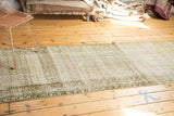 Distressed Malayer runner with abrashes revealing faded ivory, sage gold boteh pattern.