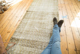 Distressed allover boteh pattern with abrashes on the vintage Malayer rug surface.
