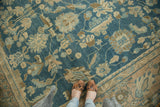 Antique Fine Lilihan carpet's sky blue field with sprawling floral motifs in beige, bronze.