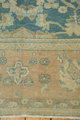 Antique Lilihan carpet with detailed hand-knotted pile, sky blue field, and beige border.