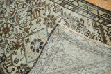 Antique Malayer rug folded corner showing hand-knotted foundation and distressed Herati motif.