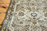 Distressed Malayer rug detail, Herati motif, antique ivory, gray, with secured side.